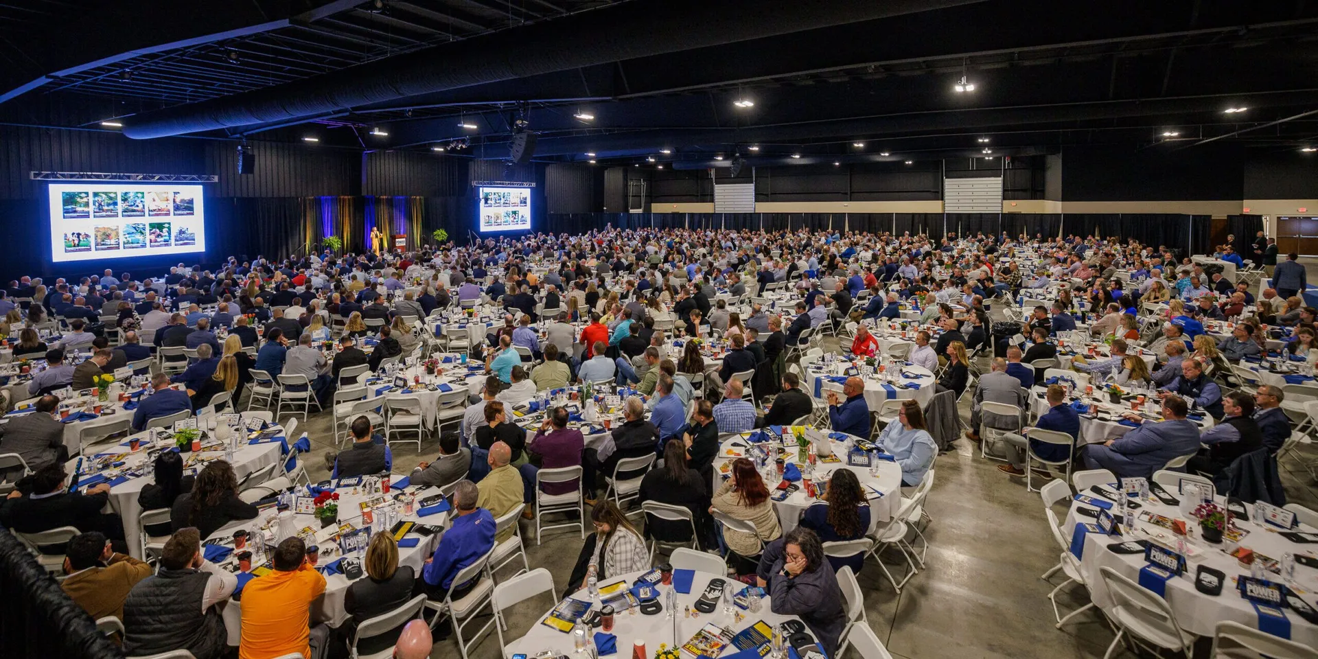 East Wing Convention Center set for a convention Power Breakfast, guests seated at banquet rounds